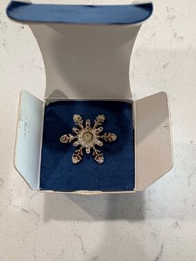 Vintage (2005) Avon Gold-Tone Snowflake Brooch with Clear and Yellow Stones
